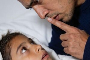 Your 8-year-old daughter whispered, “Mom said not to tell you”… and one look behind her back shattered the life you thought you knew.