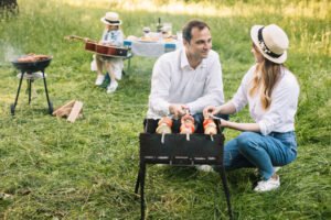 A Woman Lay On The Ground At A Birthday Party While Her Husband Acted Calm